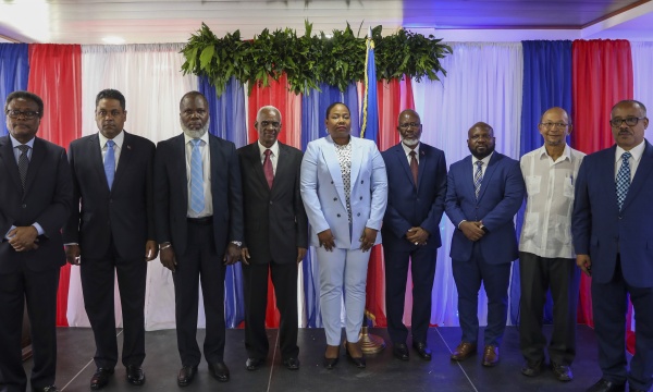 Transitional Council members, from left to right; Fritz Alphonse Jean, Laurent Saint-Cyr, Frinel Joseph, Edgard Leblanc Fils, Regine Abraham, Emmanuel Vertilaire, Smith Augustin, Leslie Voltaire and Louis Gerald Gilles, pose for a group photo after a ceremony to name its president and a prime minister in Port-au-Prince, Haiti, Tuesday, April 30, 2024.
